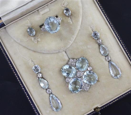 A cased early to mid 20th century 9ct white gold, aquamarine and diamond set demi-parure,